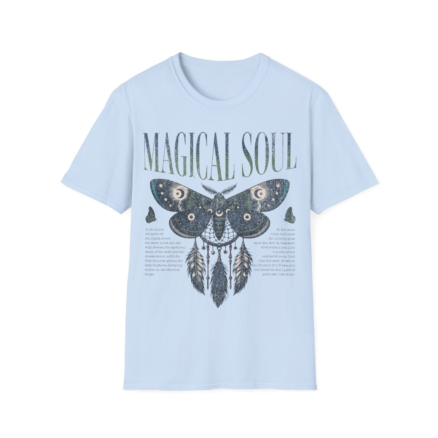 A flat-lay photograph of a light blue t-shirt featuring a detailed, mystical graphic design. The artwork displays a large moth integrated with a dreamcatcher, adorned with celestial symbols like stars and moons. Below the moth is a printed poem